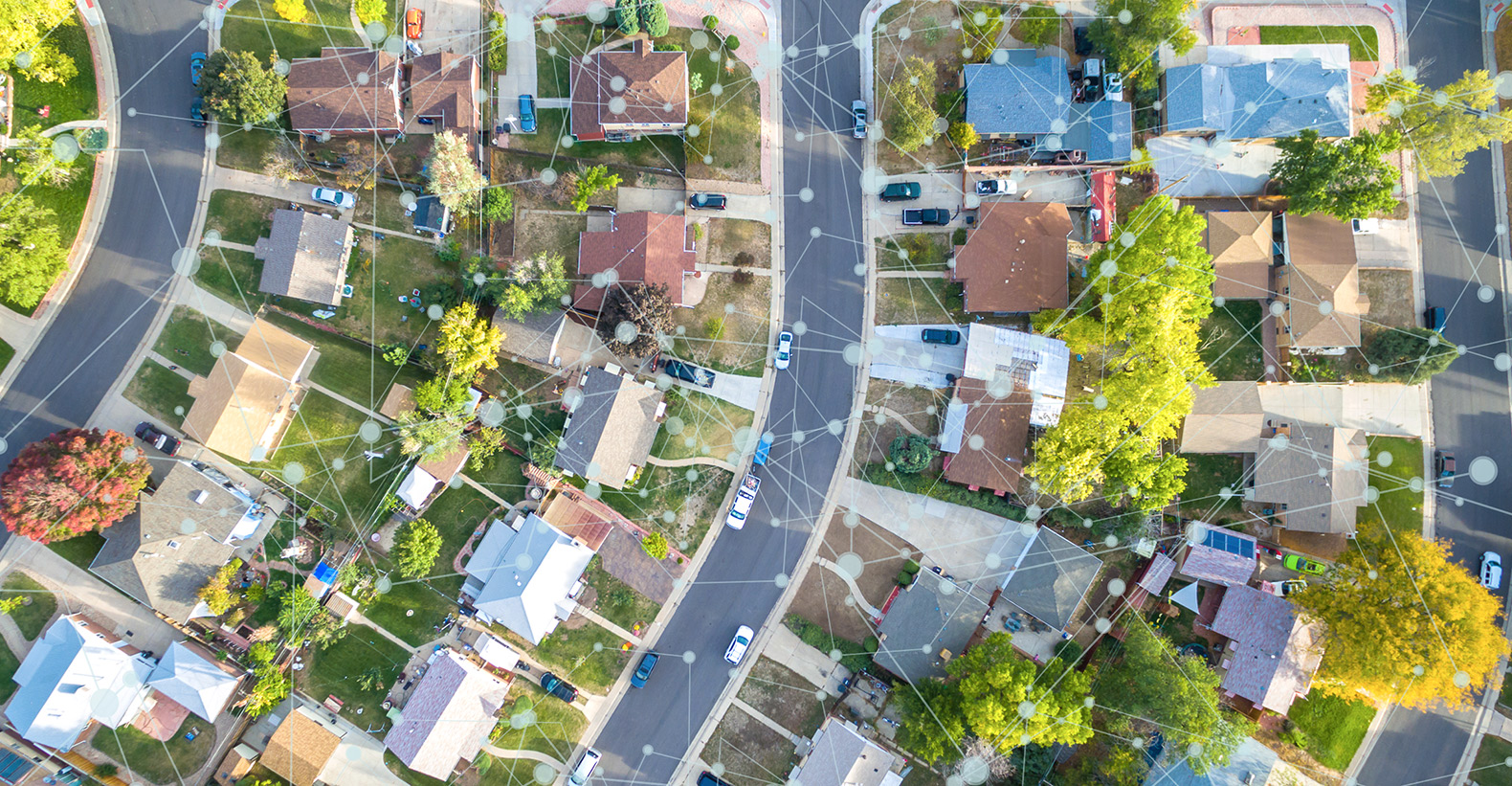 housing community with green lawns and technology